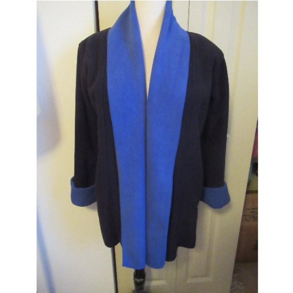 Open front blue-trmmed black jacket